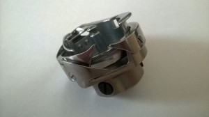 Część JUKI nr. kat. 11321452 / LUBRICATING BOBBIN ASM.