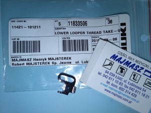 Część JUKI nr. kat. 11833506 / LOWER LOOPER THREAD TAKE-UP