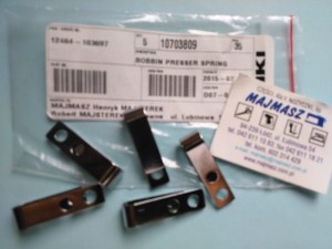 Część JUKI nr. kat. 10703809 # 107-03809 / BOBBIN PRESSER SPRING