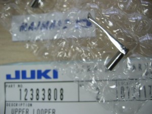 123-83808 Część JUKI nr. kat. 12383808 /  CHWYTACZ GÓRNY DO OWERLOKA MOG / UPPER SPRING