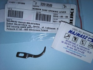 Część JUKI nr. kat. 22613509 / BOBBIN CASE OPENING LEVER