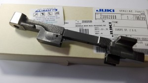 Część JUKI nr. kat. 23002009 / NEEDLE BAR ROD ROCKING BASE SET